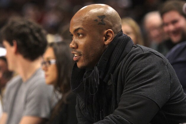 Former New York Knicks player Stephon Marbury looks on during the first half of an NBA basketball game between the Philadelphia 76ers and the New York Knicks Saturday, Oct. 31, 2009  in New York.  (AP Photo/Frank Franklin II)