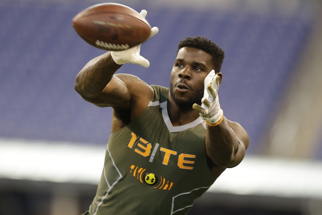Tennessee State tight end A C Leonard runs a drill at the NFL football scouting combine in Indianapolis, Saturday, Feb. 22, 2014. (AP Photo/Michael Conroy)