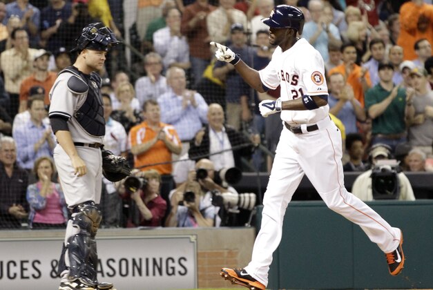 Houston Astros' Dexter Fowler (21) crosses home plate as New York Yankees catcher Brian McCann watches after hitting a home run during the first inning of a baseball game, Wednesday, April 2, 2014, in Houston. (AP Photo/Patric Schneider) Houston Astros' Dexter Fowler (21) crosses home plate as New York Yankees catcher Brian McCann watches after hitting a home run during the first inning of a baseball game, Wednesday, April 2, 2014, in Houston. (AP Photo/Patric Schneider)