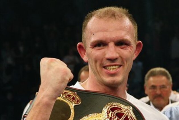 In this picture taken Saturday evening Dec. 14, 2013, German  boxer Juergen Braehmer,  celebrates after defeating US Marcus Oliveira in Neubrandenburg, eastern Germany. Germany's Juergen Braehmer defeated Marcus Oliveira by unanimous decision to take the vacant WBA world light heavyweight title on Saturday night. The judges scored it in favor of the 35-year-old Braehmer, a former WBO champion, who withstood a late barrage from the previously undefeated American in the last round to claim his second world title. The title had been vacant since Kazakhstan's Beibut Shumenov was declared the WBA's