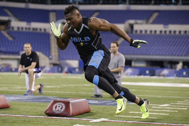 Buffalo linebacker Khalil Mack runs a drill at the NFL football scouting combine in Indianapolis, Monday, Feb. 24, 2014. (AP Photo/Michael Conroy)