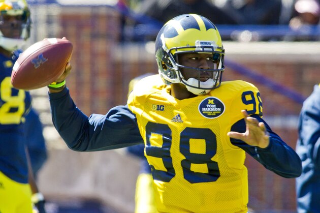 Michigan quarterback Devin Gardner (98) throws a pass during the NCAA college football team's annual spring game on Saturday, April 5, 2014, in Ann Arbor, Mich. (AP Photo/Tony Ding)