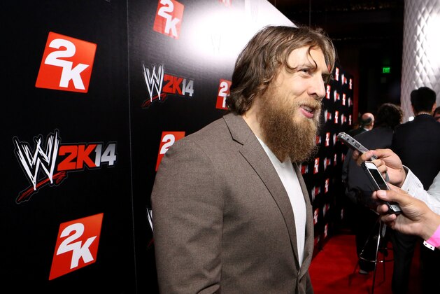 IMAGE DISTRIBUTED FOR 2K - WWE Superstar Daniel Bryan speaks to press at the WWE 2K14 press event, on Saturday, Aug. 17, 2013 in Los Angeles.  (Photo by Casey Rodgers/Invision for 2K/AP Images)