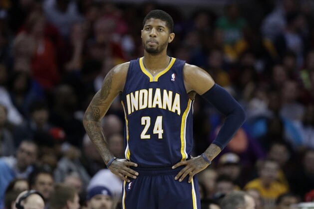 Indiana Pacers' Paul George waits for action to resume during an NBA basketball game against the Cleveland Cavaliers Sunday, March 30, 2014, in Cleveland. (AP Photo/Tony Dejak)