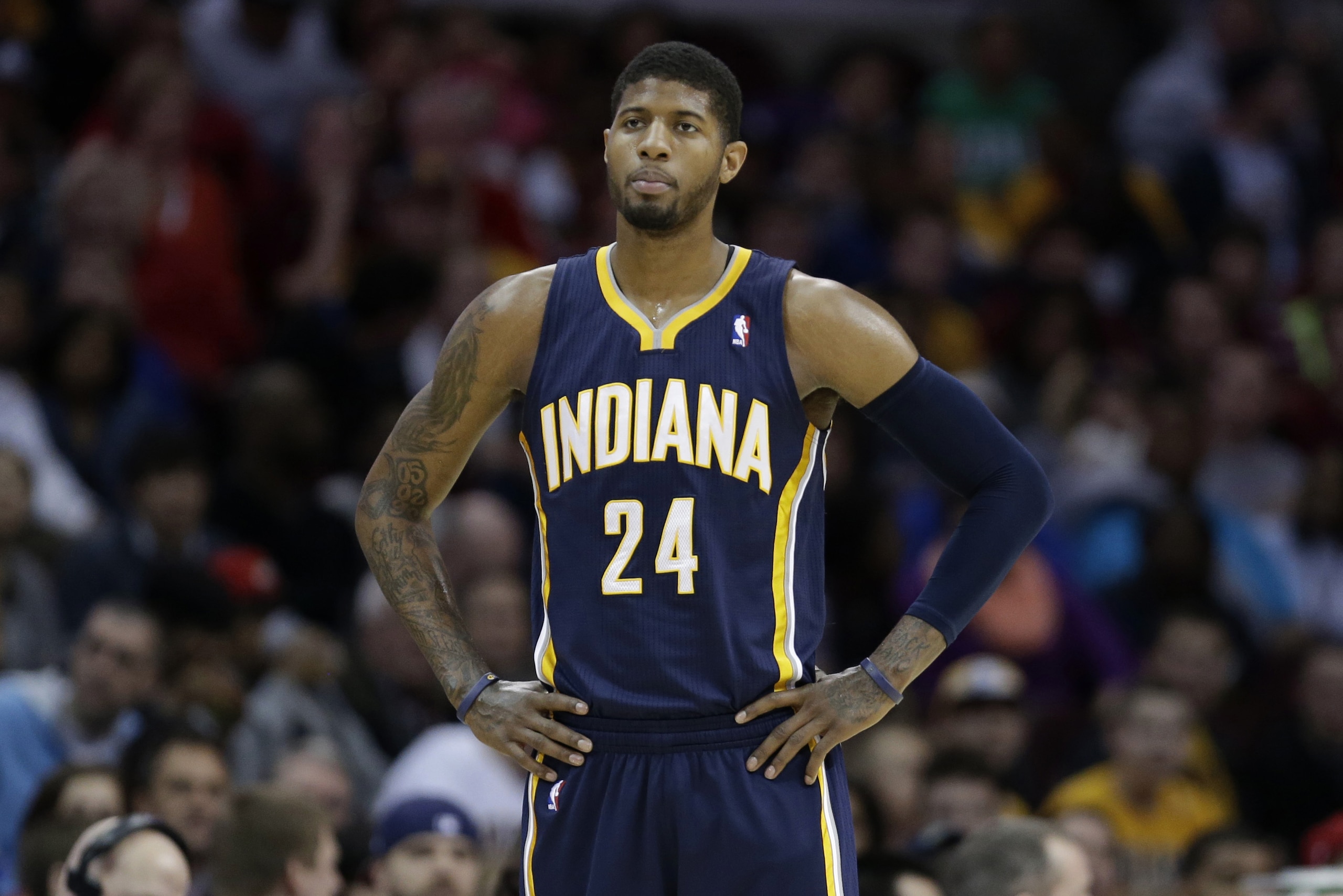 Indiana Pacers' Paul George waits for action to resume during an NBA basketball game against the Cleveland Cavaliers Sunday, March 30, 2014, in Cleveland. (AP Photo/Tony Dejak) Indiana Pacers' Paul George waits for action to resume during an NBA basketball game against the Cleveland Cavaliers Sunday, March 30, 2014, in Cleveland. (AP Photo/Tony Dejak)