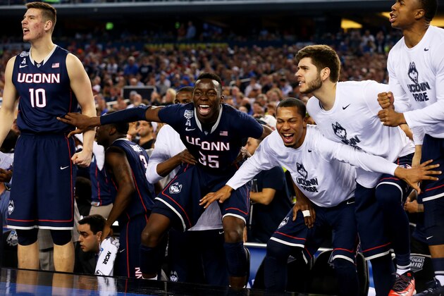 ARLINGTON, TX - APRIL 05:  The Connecticut Huskies bench reacts during the NCAA Men's Final Four Semifinal against the Florida Gators at AT&T Stadium on April 5, 2014 in Arlington, Texas.  (Photo by Ronald Martinez/Getty Images)