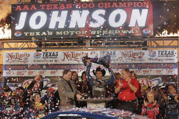 Jimmie Johnson (48) celebrates winning the NASCAR Sprint Cup series auto race at Texas Motor Speedway in Fort Worth, Texas, Sunday, Nov. 3, 2013. (AP Photo/Brandon Wade)