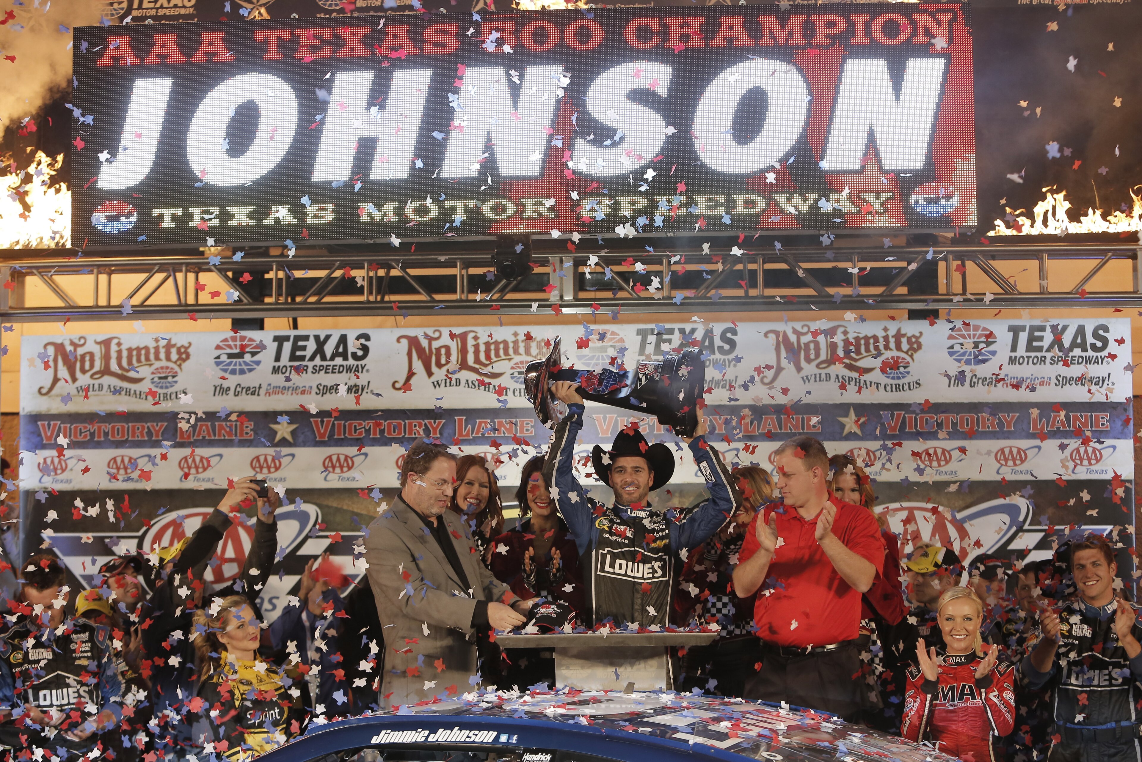 Jimmie Johnson (48) celebrates winning the NASCAR Sprint Cup series auto race at Texas Motor Speedway in Fort Worth, Texas, Sunday, Nov. 3, 2013. (AP Photo/Brandon Wade)