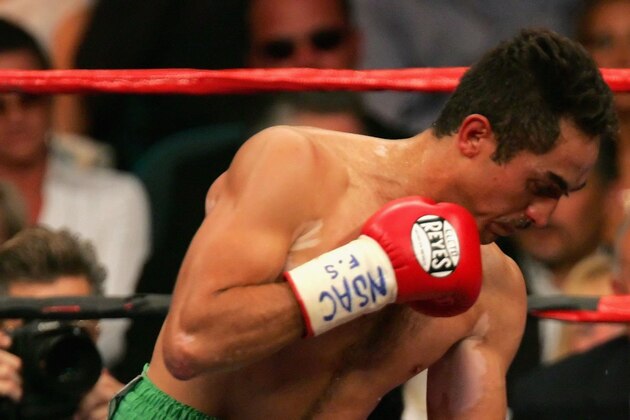 LAS VEGAS - MAY 06:  Marco Antonio Rubio (L) lands a left hook on Kassim Ouma (R) during their WBC middleweight bout on the undercard of the Ricardo Mayorga-Oscar De La Hoya fight at the MGM Grand Garden Arena May 6, 2006 in Las Vegas, Nevada.  Kassim Ouma defeated Marco Antonio Rubio in a split decision.  (Photo by Ethan Miller/Getty Images)