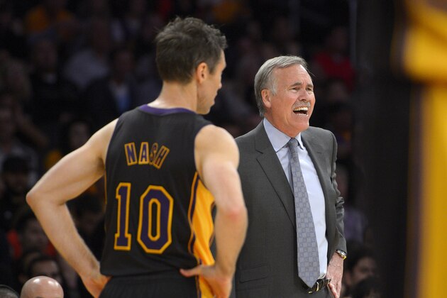 Los Angeles Lakers head coach Mike D'Antoni, right, yells at referees as guard Steve Nash looks on during the second half of an NBA basketball game against the Washington Wizards, Friday, March 21, 2014, in Los Angeles. The Wizards won 117-107. (AP Photo/Mark J. Terrill)