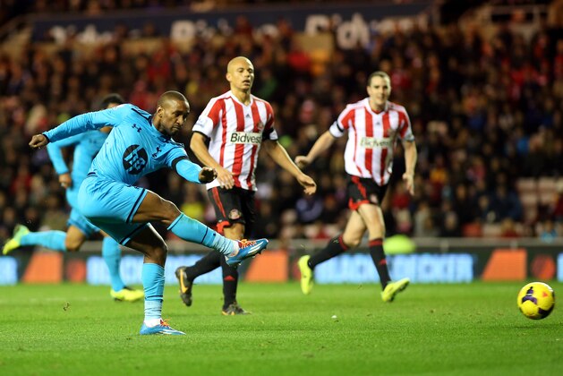 Tottenham Hotspurs' Jermain Defoe, left, has a shot towards goal past Sunderland's Wes Brown, center, and John O'Shea, right, during their English Premier League soccer match at the Stadium of Light, Sunderland, England, Saturday, Dec. 7, 2013. (AP Photo/Scott Heppell) Tottenham Hotspurs' Jermain Defoe, left, has a shot towards goal past Sunderland's Wes Brown, center, and John O'Shea, right, during their English Premier League soccer match at the Stadium of Light, Sunderland, England, Saturday, Dec. 7, 2013. (AP Photo/Scott Heppell)