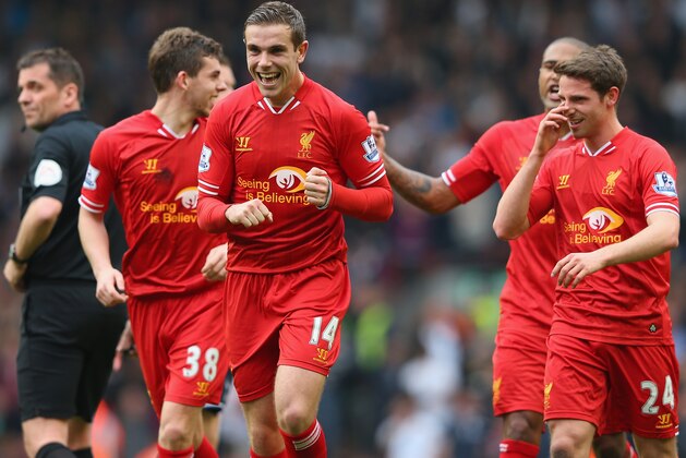 LIVERPOOL, ENGLAND - MARCH 30:  Jordan Henderson of Liverpool celebrates with his team-mates after scoring the fourth goal during the Barclays Premier League match between Liverpool and Tottenham Hotspur at Anfield on March 30, 2014 in Liverpool, England.  (Photo by Alex Livesey/Getty Images)