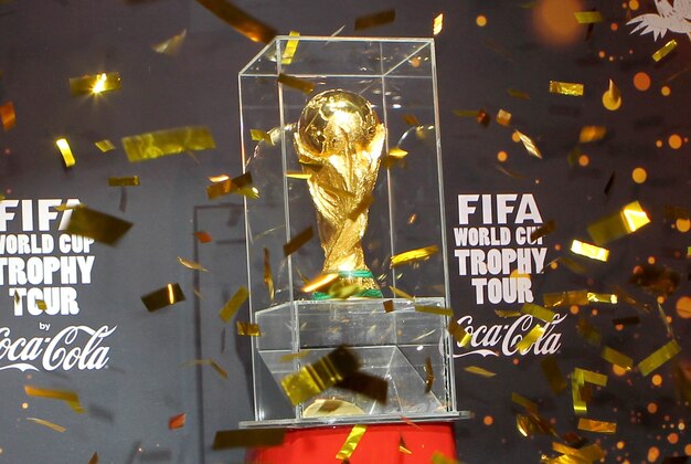 ROME, ITALY - FEBRUARY 20:  Antonio Cabrini unveils the FIFA World Cup Trophy at a party during day two of the FIFA World Cup Trophy Tour on February 20, 2014 in Rome, Italy.  (Photo by Paolo Bruno/Getty Images for Coca-Cola)