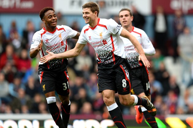 LONDON, ENGLAND - APRIL 06:  Steven Gerrard (C)of Liverpool celebrates with teammate Raheem Sterling (L) after scoring the opening goal from the penalty spot during the Barclays Premier League match between West Ham United and Liverpool at Boleyn Ground on April 6, 2014 in London, England.  (Photo by Mike Hewitt/Getty Images)