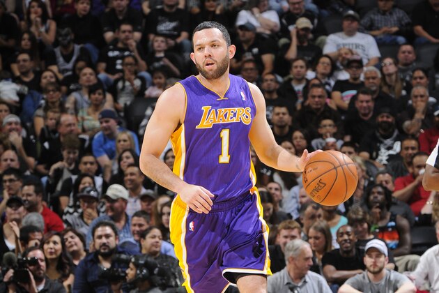 SAN ANTONIO, TX - March 14: Jordan Farmar #1 of the Los Angeles Lakers moves the ball up-court against the San Antonio Spurs at the AT&T Center on March 14, 2014 in San Antonio, Texas. NOTE TO USER: User expressly acknowledges and agrees that, by downloading and or using this photograph, user is consenting to the terms and conditions of the Getty Images License Agreement. Mandatory Copyright Notice: Copyright 2014 NBAE (Photos by D. Clarke Evans/NBAE via Getty Images)