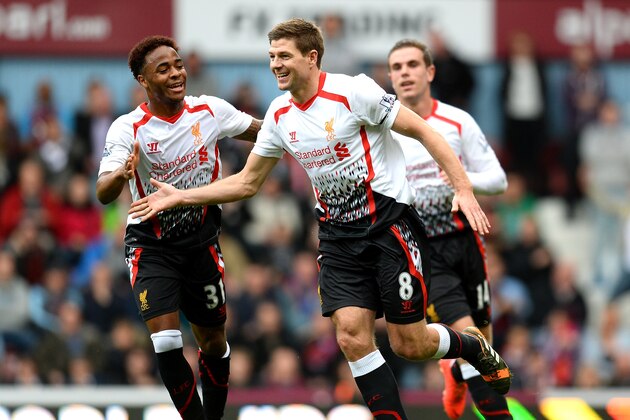 LONDON, ENGLAND - APRIL 06:  Steven Gerrard (C)of Liverpool celebrates with teammate Raheem Sterling (L) after scoring the opening goal from the penalty spot during the Barclays Premier League match between West Ham United and Liverpool at Boleyn Ground on April 6, 2014 in London, England.  (Photo by Mike Hewitt/Getty Images)