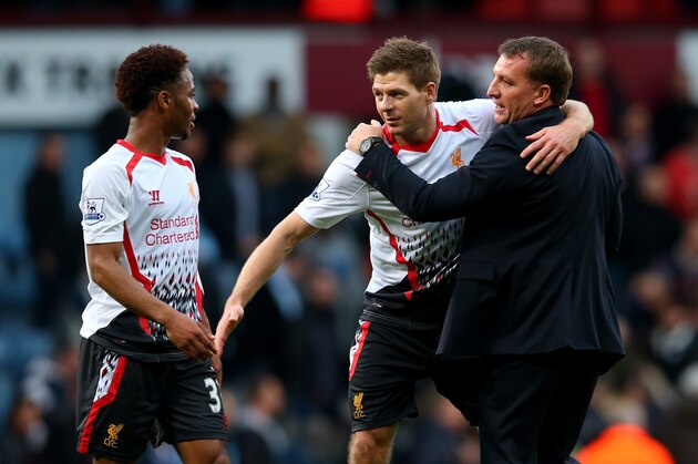 LONDON, ENGLAND - APRIL 06:  (L-R) Raheem Sterling, Steven Gerard and Brendan Rogers of Liverpool celebrate their team's 2-1 victory during the Barclays Premier League match between West Ham United and Liverpool at Boleyn Ground on April 6, 2014 in London, England.  (Photo by Julian Finney/Getty Images)