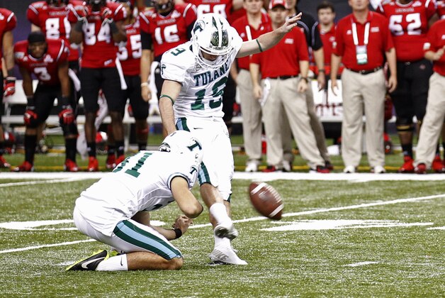 Tulane kicker Cairo Santos (19) tries to kick a 48-yard field goal late in the game during the second half of the New Orleans Bowl NCAA college football game, in New Orleans, Saturday, Dec. 21, 2013. Santos missed the kick to tie the game and Louisiana-Lafayette defeated Tulane 24-21. Holding for santos is Tulane punter Peter Picerelli (31).  (AP Photo/Bill Haber)