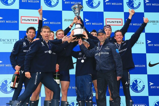 LONDON, ENGLAND - APRIL 06:  The Oxford crew celebrate victory with the trophy during the BNY Mellon 160th Oxford versus Cambridge University Boat Race on The River Thameson April 6, 2014 in London, England.  (Photo by Richard Heathcote/Getty Images)