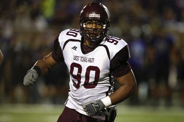 West Texas A&M defensive lineman Ethan Westbrooks (90) rushes the Tarleton State offense during the first half of an NCAA football game, Saturday, Oct. 12, 2013, in Stephenville, Texas. (AP Photo/Jim Cowsert)