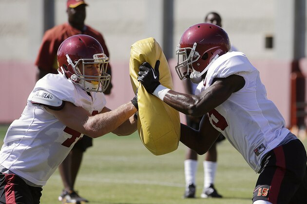 Southern California wide receiver Robby Kolanz, left, pushes wide receiver Nelson Agholor during NCAA college football practice on Tuesday, Aug. 6, 2013, in Los Angeles. (AP Photo/Jae C. Hong)
