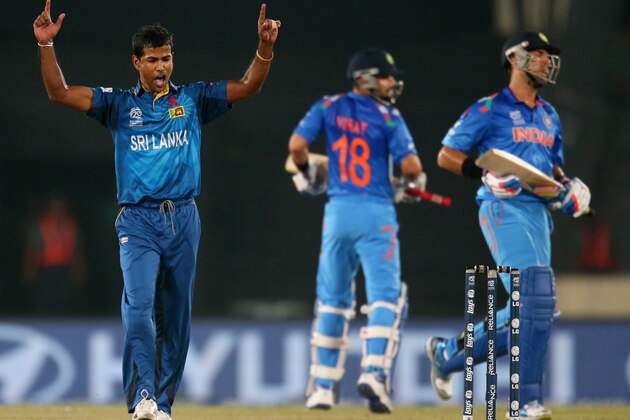 DHAKA, BANGLADESH - APRIL 06:  Nuwan Kulasekara of Sri Lanka celebrates after dismissing Yuvraj Singh (R) of India during the Final of the ICC World Twenty20 Bangladesh 2014 between India and Sri Lanka at Sher-e-Bangla Mirpur Stadium on April 4, 2014 in Dhaka, Bangladesh.  (Photo by Scott Barbour/Getty Images)