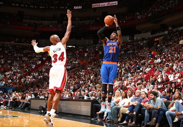 MIAMI, FL - APRIL 6: Iman Shumpert #21 of the New York Knicks shoots over Ray Allen #34 of the Miami Heat during a game on April 6, 2014 at American Airlines Arena in Miami, Florida.  NOTE TO USER: User expressly acknowledges and agrees that, by downloading and or using this photograph, User is consenting to the terms and conditions of the Getty Images License Agreement. Mandatory Copyright Notice: Copyright 2014 NBAE  (Photo by Nathaniel S. Butler/NBAE via Getty Images)