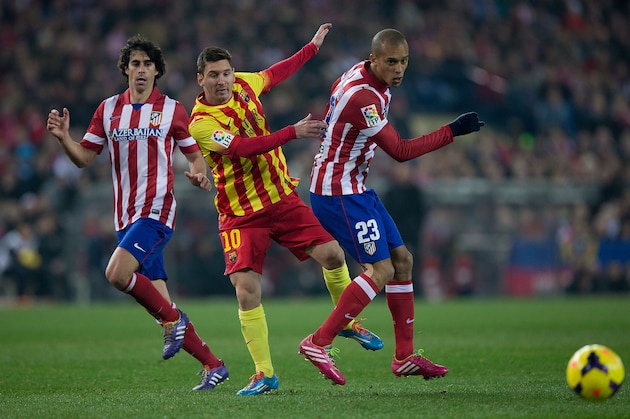 MADRID, SPAIN - JANUARY 11: Joao Miranda (R) of Atletico de Madrid steals the ball from Lionel Messi (2nd R) of FC Barcelona as Tiago Mendes (L) looks on during the La Liga match between Club Atletico de Madrid and FC Barcelona at Vicente Calderon Stadium on January 11, 2014 in Madrid, Spain. (Photo by Gonzalo Arroyo Moreno/Getty Images) MADRID, SPAIN - JANUARY 11: Joao Miranda (R) of Atletico de Madrid steals the ball from Lionel Messi (2nd R) of FC Barcelona as Tiago Mendes (L) looks on during the La Liga match between Club Atletico de Madrid and FC Barcelona at Vicente Calderon Stadium on January 11, 2014 in Madrid, Spain. (Photo by Gonzalo Arroyo Moreno/Getty Images)