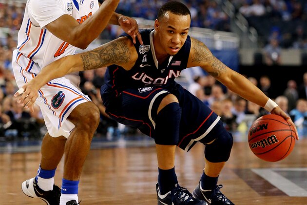 ARLINGTON, TX - APRIL 05: Shabazz Napier #13 of the Connecticut Huskies drives to the basket as Kasey Hill #0 of the Florida Gators during the NCAA Men's Final Four Semifinal at AT&T Stadium on April 5, 2014 in Arlington, Texas.  (Photo by Ronald Martinez/Getty Images)