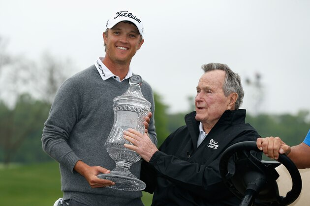 HUMBLE, TX - APRIL 06: (L-R) Matt Jones of Australia and Former U.S. President George H. W. Bush poses with the trophy after defeating Matt Kuchar of the United States in the first hole of the playoff in the final round of the Shell Houston Open at the Golf Club of Houston on April 6, 2014 in Humble, Texas. (Photo by Scott Halleran/Getty Images) HUMBLE, TX - APRIL 06: (L-R) Matt Jones of Australia and Former U.S. President George H. W. Bush poses with the trophy after defeating Matt Kuchar of the United States in the first hole of the playoff in the final round of the Shell Houston Open at the Golf Club of Houston on April 6, 2014 in Humble, Texas. (Photo by Scott Halleran/Getty Images)