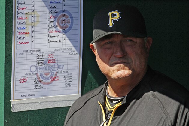 Pittsburgh Pirates manager Clint Hurdle stands in the dugout before the opening day baseball game between the Pittsburgh Pirates and the Chicago Cubs  in Pittsburgh Monday, March 31, 2014. The Pirates won 1-0 in ten innings. (AP Photo/Gene J. Puskar)