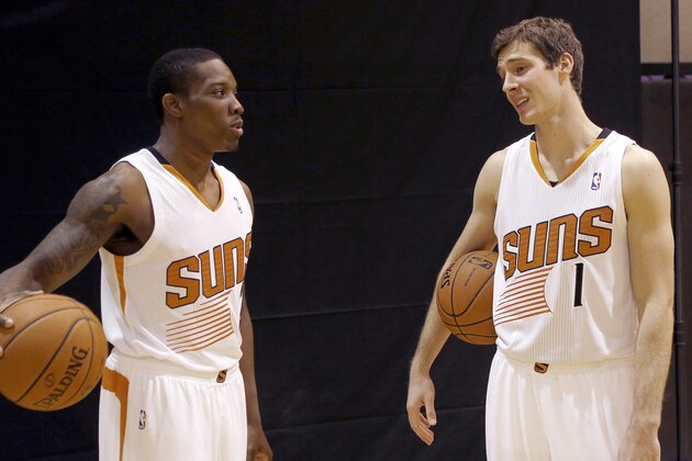 Phoenix Suns teammates Goran Dragic (1), of Slovenia, and Eric Bledsoe talk during the team's NBA basketball media day on Monday, Sept. 30, 2013, in Phoenix. (AP Photo/Ross D. Franklin)