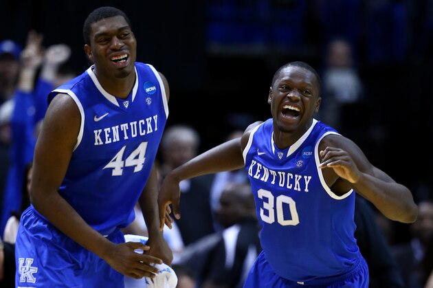 ST LOUIS, MO - MARCH 23:  Julius Randle #30 of the Kentucky Wildcats celebrates with teammate Dakari Johnson #44 after defeating the Wichita State Shockers 78 to 76 during the third round of the 2014 NCAA Men's Basketball Tournament at Scottrade Center on March 23, 2014 in St Louis, Missouri.  (Photo by Andy Lyons/Getty Images)