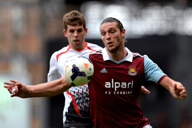 LONDON, ENGLAND - APRIL 06:  Andy Carroll of West Ham controls the ball as Jon Flanagan of Liverpool closes during the Barclays Premier League match between West Ham United and Liverpool at Boleyn Ground on April 6, 2014 in London, England.  (Photo by Mike Hewitt/Getty Images)