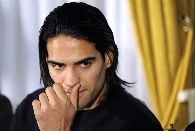 Colombian soccer star Radamel Falcao reacts as he attends a press conference at the Trindade Hospital in Porto, Portugal, Monday, Jan. 27, 2014. Colombia and Monaco's striker Falcao is in a race against time to get fit for the World Cup in June after undergoing knee surgery Saturday, Jan. 25, with his doctor giving him a better than 50-50 chance of making it. (AP Photo/Paulo Duarte)