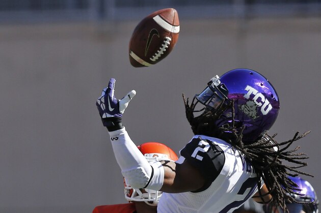 TCU cornerback Jason Verrett (2) can't hold onto a pass intended for Oklahoma State receiver Josh Stewart (5) during an NCAA college football game in Stillwater, Okla., Saturday, Oct. 19, 2013. (AP Photo/Sue Ogrocki)