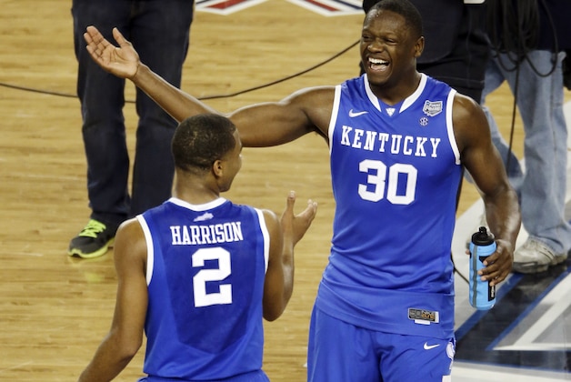 After Kentucky guard Aaron Harrison (2) made a three-point basket in the final seconds against Wisconsin to win the game 74-73, he celebrates with Julius Randle (30) at the end of their NCAA Final Four tournament college basketball semifinal game Saturday, April 5, 2014, in Arlington, Texas. (AP Photo/Tony Gutierrez)