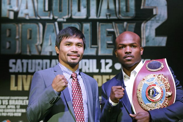 Boxer Manny Pacquiao, of the Phillipines, left, poses for a photo with current WBO World Welterweight champion Timothy Bradley of Indio, Ca., during a press conference Thursday, Feb. 6, 2014, in New York. The pair will face off in a rematch of their previous title fight in Las Vegas, April 12, 2014. Bradley won their first encounter. (AP Photo/Kathy Willens)