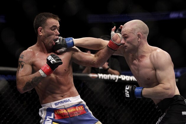 Martin Kampmann, right, of Denmark, lands a right to the face of Jake Shields during a UFC mixed martial arts match in Anaheim, Calif., Saturday, Oct. 23, 2010. (AP Photo/Jae C. Hong)
