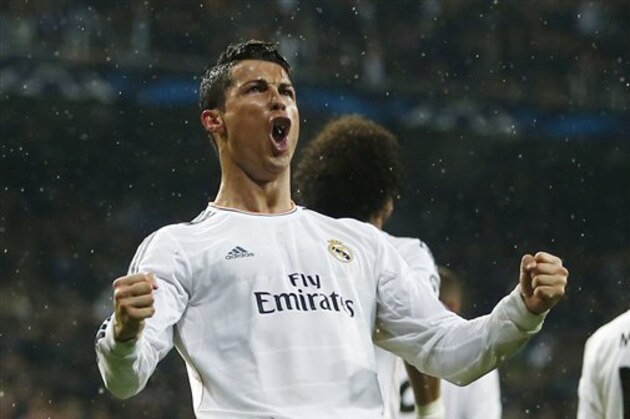 Real's Cristiano Ronaldo celebrates scoring his side's 3rd goal during a Champions League quarterfinal first leg soccer match between Real Madrid and Borussia Dortmund at the Santiago Bernabeu   stadium in Madrid, Spain, Wednesday, April 2, 2014. (AP Photo/Andres Kudacki)