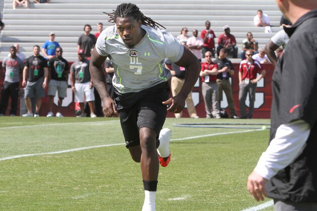 South Carolina defensive end Jadeveon Clowney competes in a drill for NFL representatives at South Carolina football pro day in Columbia, S.C., Wednesday, April 2, 2014. (AP Photo/Mary Ann Chastain)