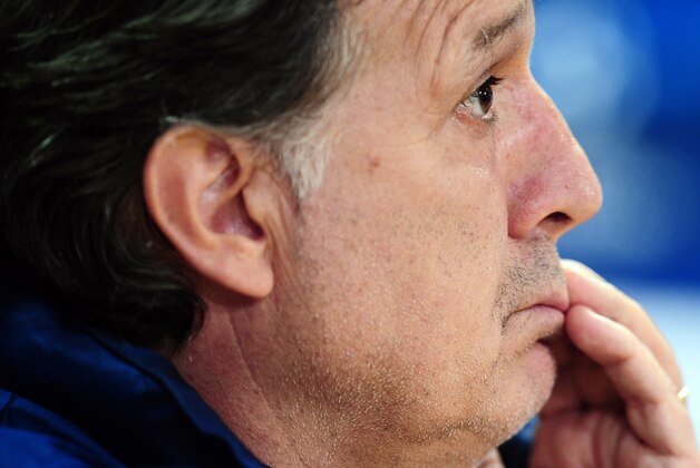 FC Barcelona's coach Gerardo Tata Martino, from Argentina, attends a news conference at the Sports Center FC Barcelona Joan Gamper in San Joan Despi, Spain, Tuesday, March 11, 2014. . FC Barcelona will play against Manchester City in a last sixteen Champions League soccer match on Wednesday March 12. (AP Photo/Manu Fernandez)