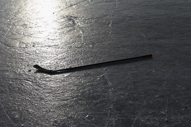 EAGLE RIVER, WI - FEBRUARY 09:  A close up of a stick on the ice during the 2013 USA Hockey Pond Hockey National Championships on February 9, 2013 in Eagle River, Wisconsin. The three-day tournament features 2,400 participants from 30 states playing a round robin tournament on 28 rinks laid out on Dollar Lake.  (Photo by Bruce Bennett/Getty Images)