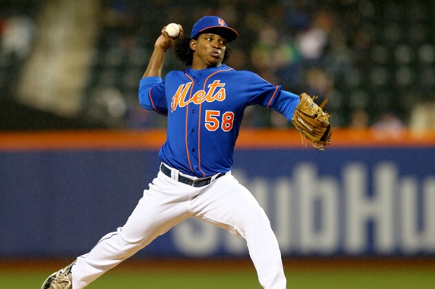 NEW YORK, NY - APRIL 04:  Jenrry Mejia #58 of the New York Mets delivers a pitch in the first inning against the Cincinnati Reds on April 4, 2014 at Citi Field in the Flushing neighborhood of the Queens borough of New York City.  (Photo by Elsa/Getty Images)