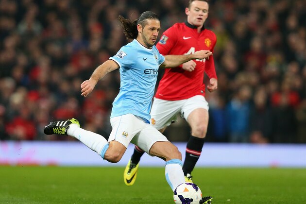 MANCHESTER, ENGLAND - MARCH 25:  Martin Demichelis of Manchester City in action during the Barclays Premier League match between Manchester United and Manchester City at Old Trafford on March 25, 2014 in Manchester, England.  (Photo by Alex Livesey/Getty Images)