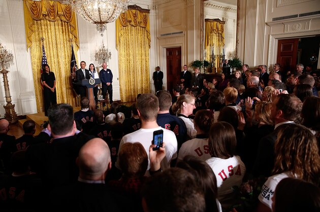 WASHINGTON, DC - APRIL 03:  U.S. President Barack Obama speaks during an event honoring the 2014 Olympic and Paralympic teams with Jon Lujan (R) and Julie Chi (C) at the White House April 3, 2014 in Washington, DC. Obama congratulated the Olympians and Paralympians on their performance and thanked them for representing the U.S. during the 2014 Olympic Winter Games in Sochi, Russia.  (Photo by Win McNamee/Getty Images)