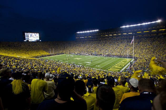 Fans cheer on Michigan and Notre Dame as they begin an NCAA college football game, in Ann Arbor, Mich., Saturday, Sept. 7, 2013. This is only the second ever night game played at Michigan Stadium. Michigan won 41-30. (AP Photo/Tony Ding) Fans cheer on Michigan and Notre Dame as they begin an NCAA college football game, in Ann Arbor, Mich., Saturday, Sept. 7, 2013. This is only the second ever night game played at Michigan Stadium. Michigan won 41-30. (AP Photo/Tony Ding)
