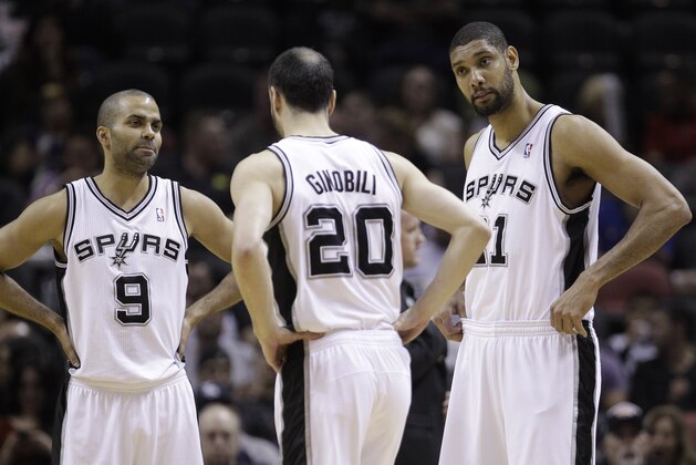 San Antonio Spurs' Tony Parker (9), of France, Manu Ginobili, center, and Tim Duncan, right, during the first quarter of an NBA basketball game against the Detroit Pistons, Wednesday, March 9, 2011 in San Antonio. (AP Photo/Eric Gay)