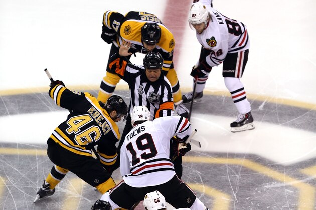 BOSTON, MA - JUNE 19: David Krejci #46 of the Boston Bruins and Jonathan Toews #19 of the Chicago Blackhawks face off to start Game Four of the 2013 NHL Stanley Cup Final at TD Garden on June 19, 2013 in Boston, Massachusetts.  (Photo by Bruce Bennett/Getty Images)