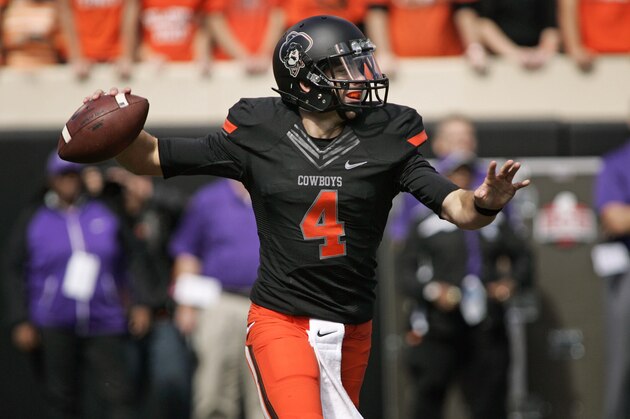 STILLWATER, OK - OCTOBER 5:   Quarterback J.W. Walsh #4 of the Oklahoma State Cowboys looks to throw against the Kansas State Wildcats October 5, 2013 at Boone Pickens Stadium in Stillwater, Oklahoma. The Cowboys defeated the Wildcats 33-29.  (Photo by Brett Deering/Getty Images)